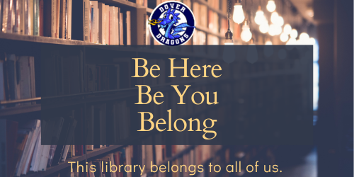 books on library shelf with hanging light bulbs